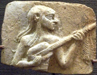 Egyptian Artist 3,500 years old playing a guitar-like instrument